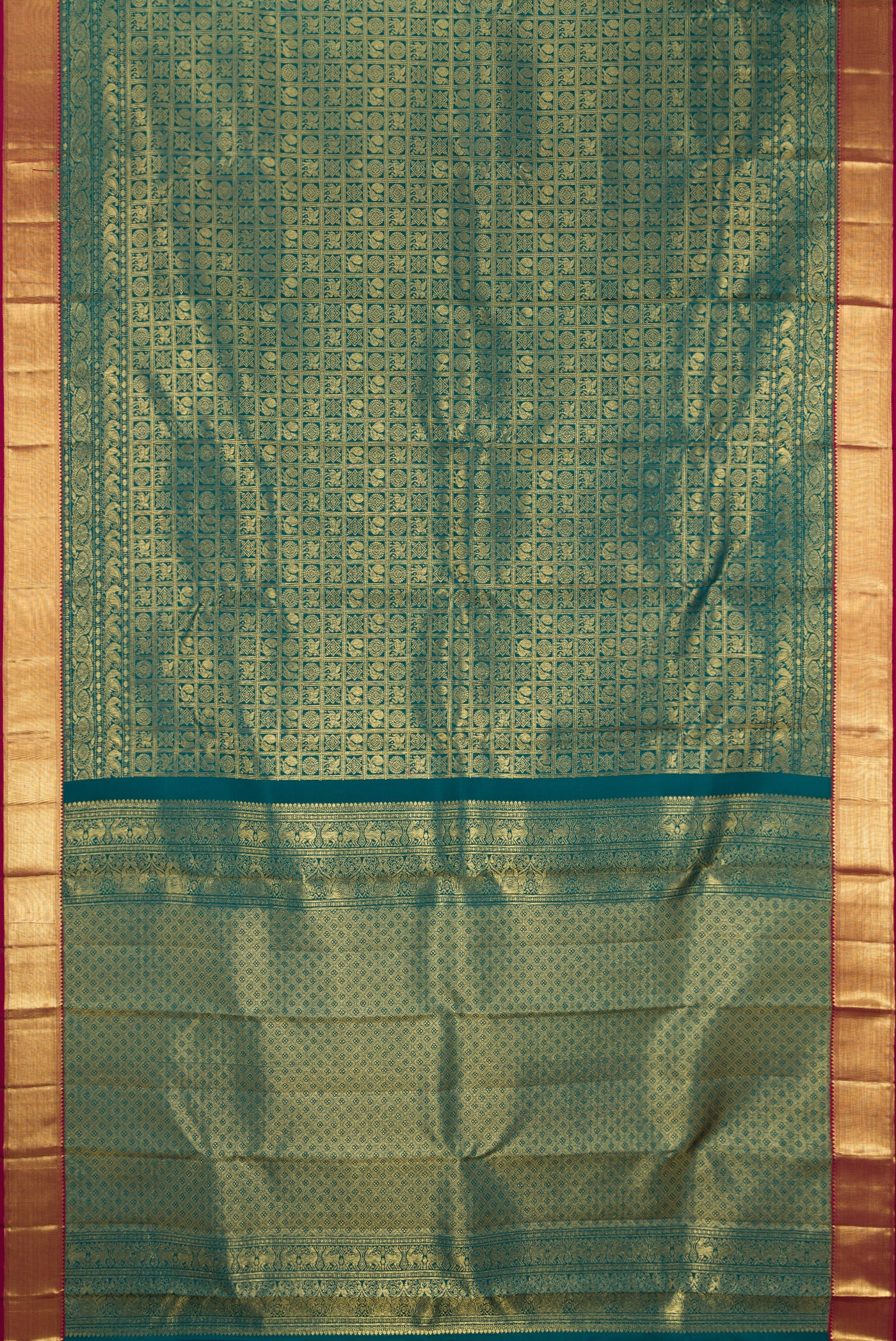 Green Dual Tone Kanchipuram Silk Saree with Zari Brocade on the body and Zari Border.  displayed on a mannequin