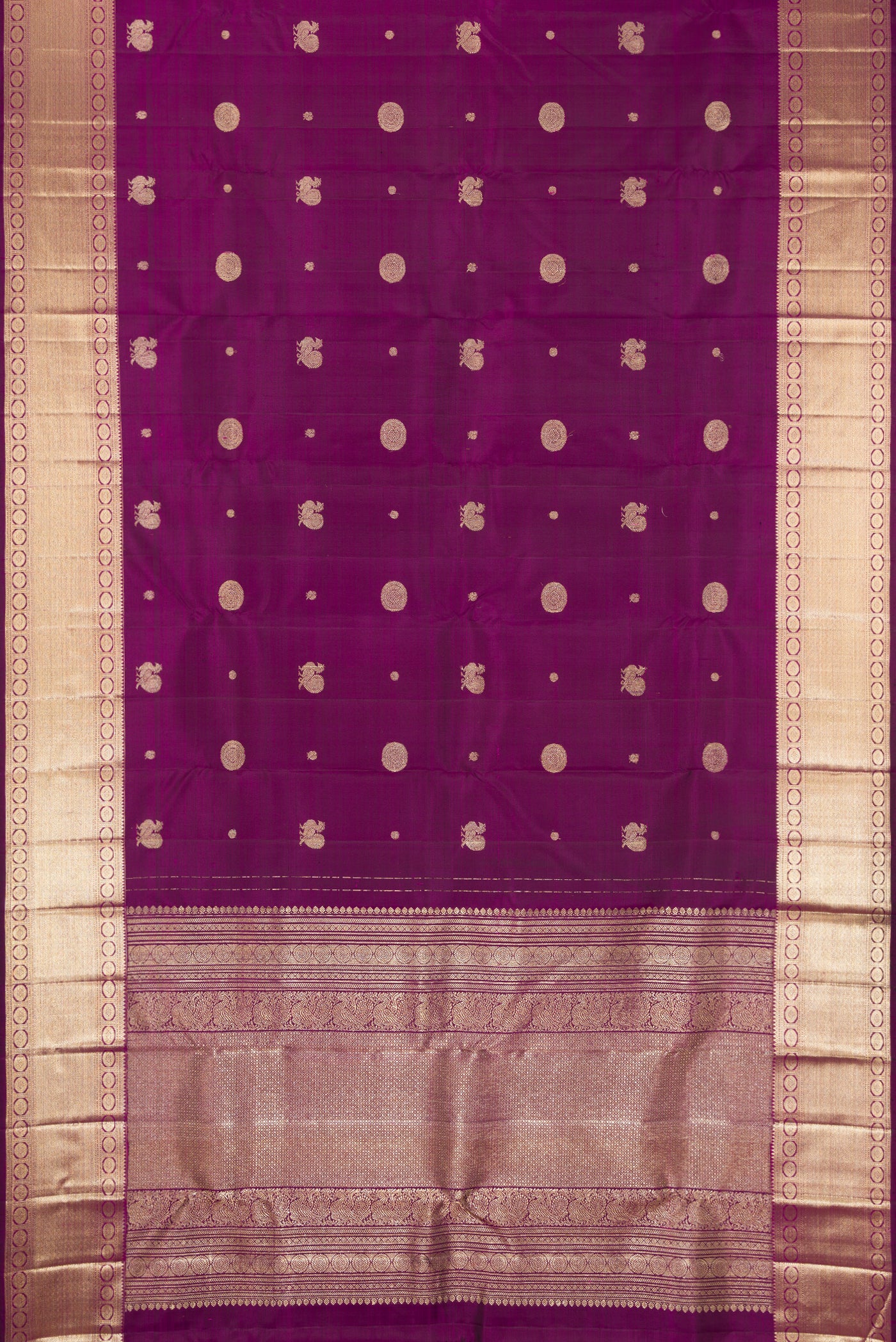 Purple Dual Tone Kanchipuram Silk Saree with Zari Butta on the body and Zari Border.  displayed on a mannequin