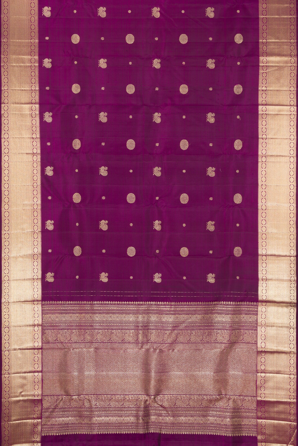 Purple Dual Tone Kanchipuram Silk Saree with Zari Butta on the body and Zari Border.  displayed on a mannequin
