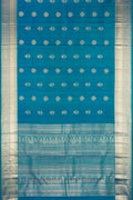 Peacock Blue Dual Tone Kanchipuram Silk Saree with Zari Butta on the body and Zari Border.  displayed on a mannequin