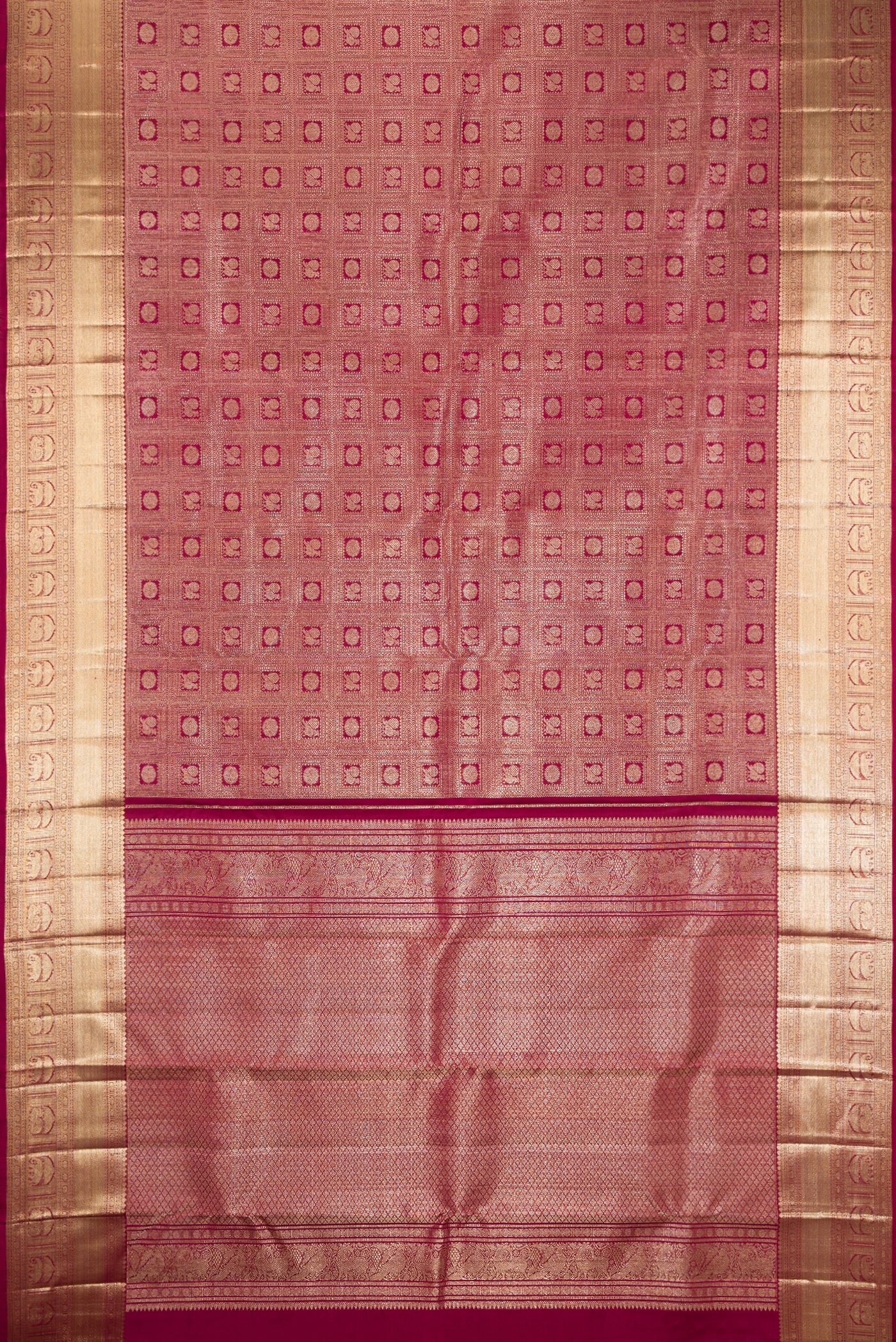 Maroon Dual Tone Kanchipuram Silk Saree with Zari Brocade on the body and Fancy Border.  displayed on a mannequin