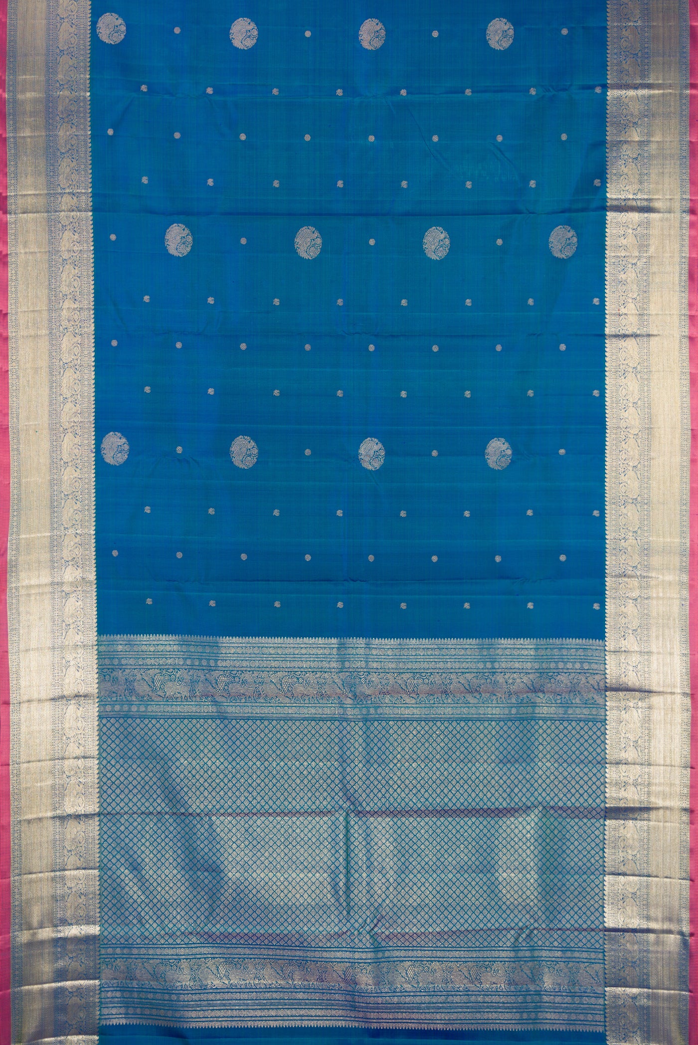 Peacock Blue Dual Tone Kanchipuram Silk Saree with Zari Butta on the body and Fancy Border.  displayed on a mannequin