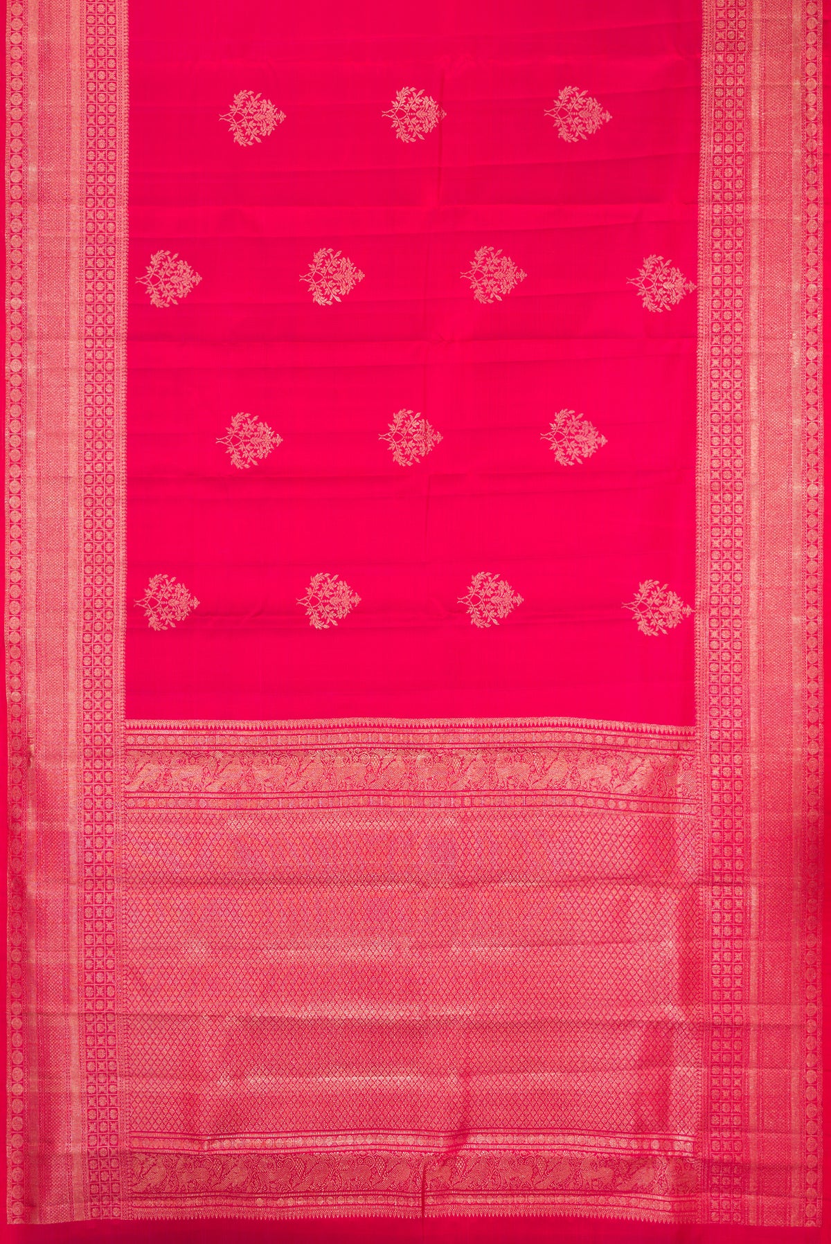 Dark Pink Dual Tone Kanchipuram Silk Saree with Zari Butta on the body and Fancy Border.  displayed on a mannequin