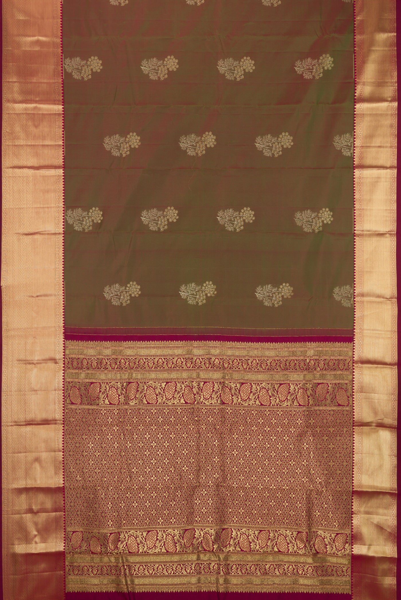 Mehandi Green Dual Tone Kanchipuram Silk Saree with Zari Butta on the body and Zari Border.  displayed on a mannequin