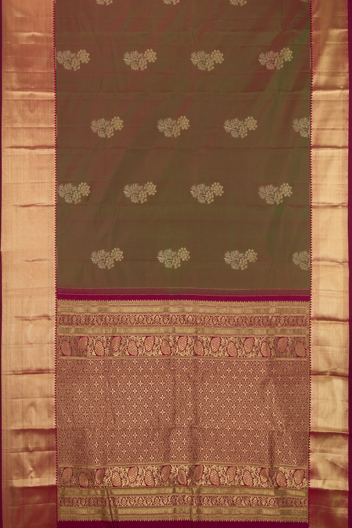 Mehandi Green Dual Tone Kanchipuram Silk Saree with Zari Butta on the body and Zari Border.  displayed on a mannequin