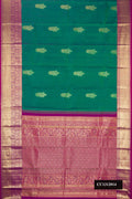 Peacock Blue Dual Tone Kanchipuram Silk Saree with Zari Butta on the body and Zari Border.  displayed on a mannequin