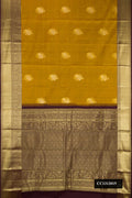 Mehandi Green Dual Tone Kanchipuram Silk Saree with Zari Butta on the body and Zari Border.  displayed on a mannequin