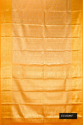 Mustard Dual Tone Kanchipuram Tissue Silk Saree with Zari Brocade on the body and Zari Border.  displayed on a mannequin