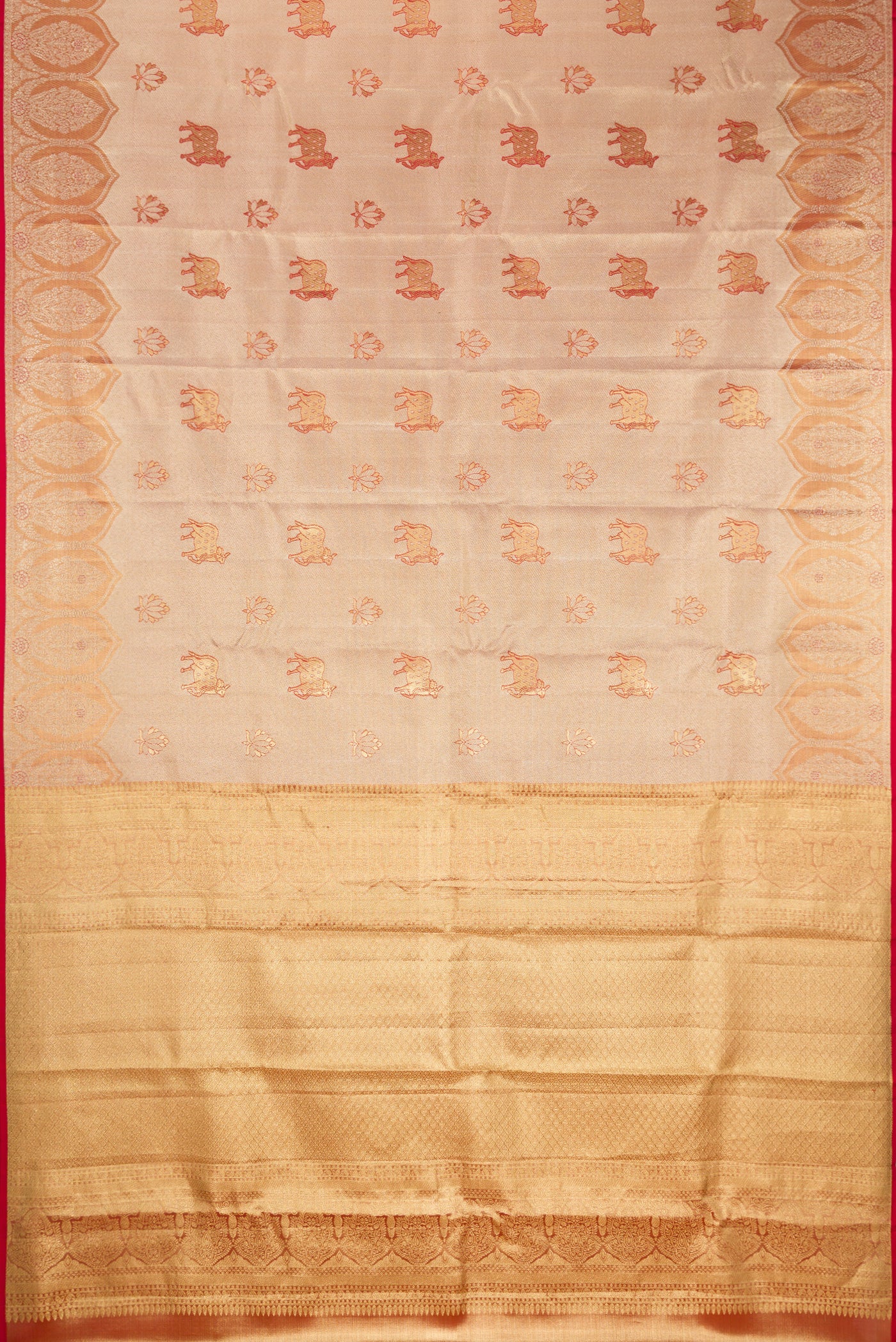 Gold Dual Tone Kanchipuram Tissue Silk Saree with Zari Brocade on the body and Fancy Border.  displayed on a mannequin