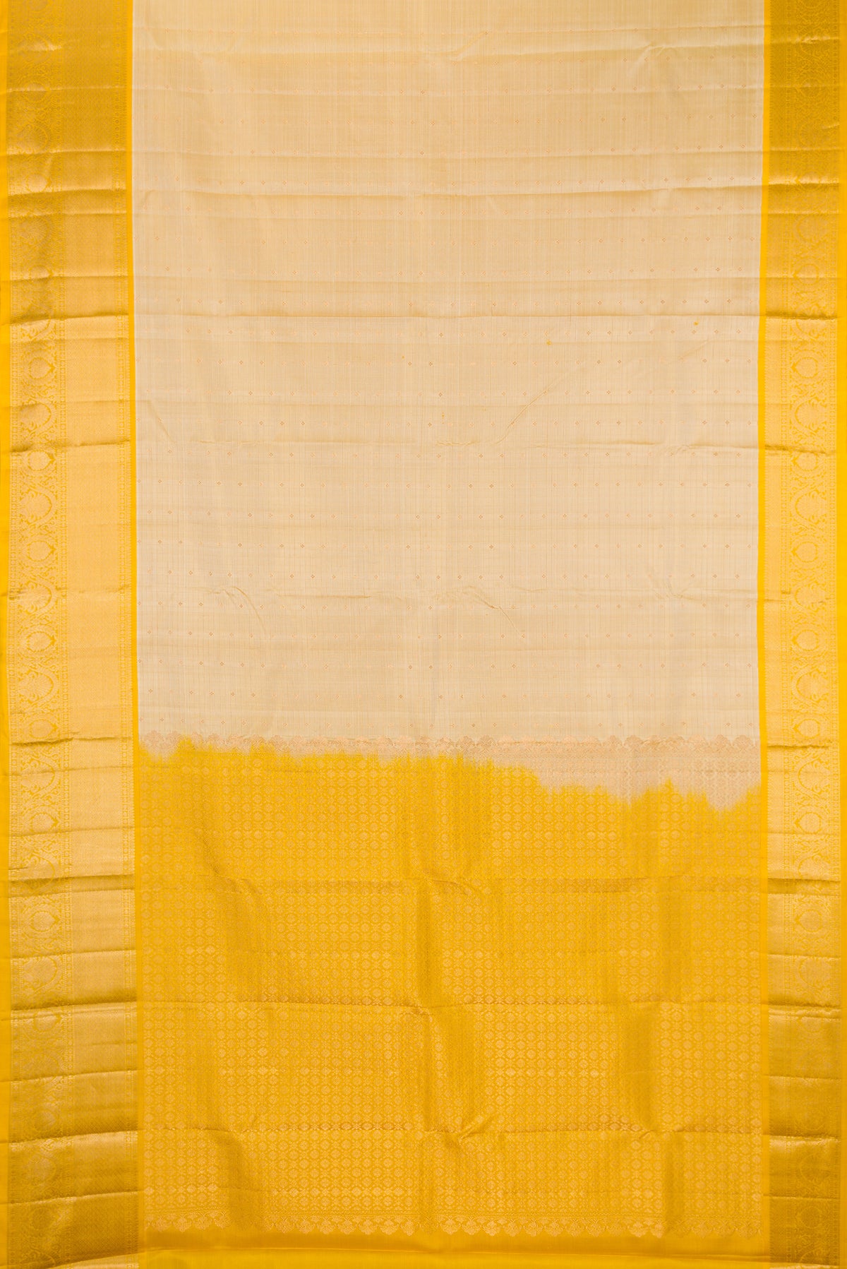 Beige Dual Tone Kanchipuram Silk Saree with Checked design on the body and Fancy Border.  displayed on a mannequin