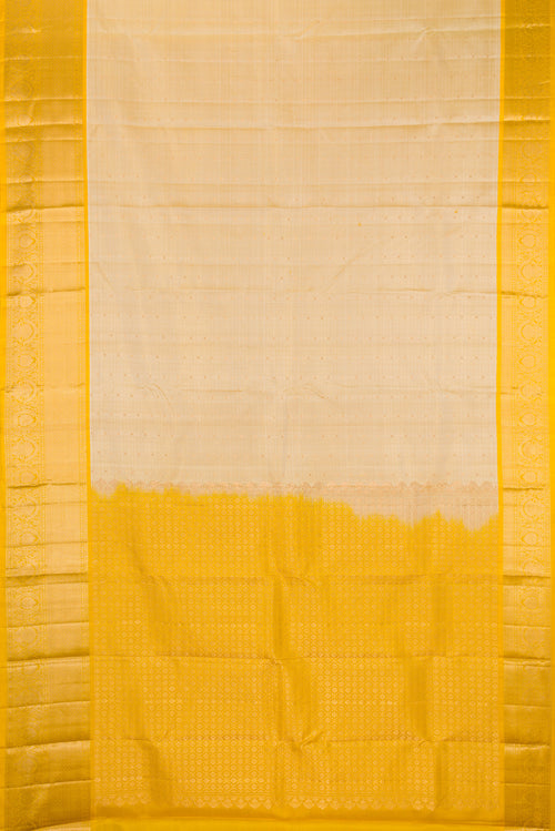 Beige Dual Tone Kanchipuram Silk Saree with Checked design on the body and Fancy Border.  displayed on a mannequin