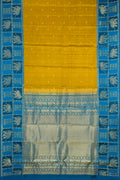 Mehandi Green Dual Tone Kanchipuram Silk Saree with Zari Butta on the body and Fancy Border.  displayed on a mannequin