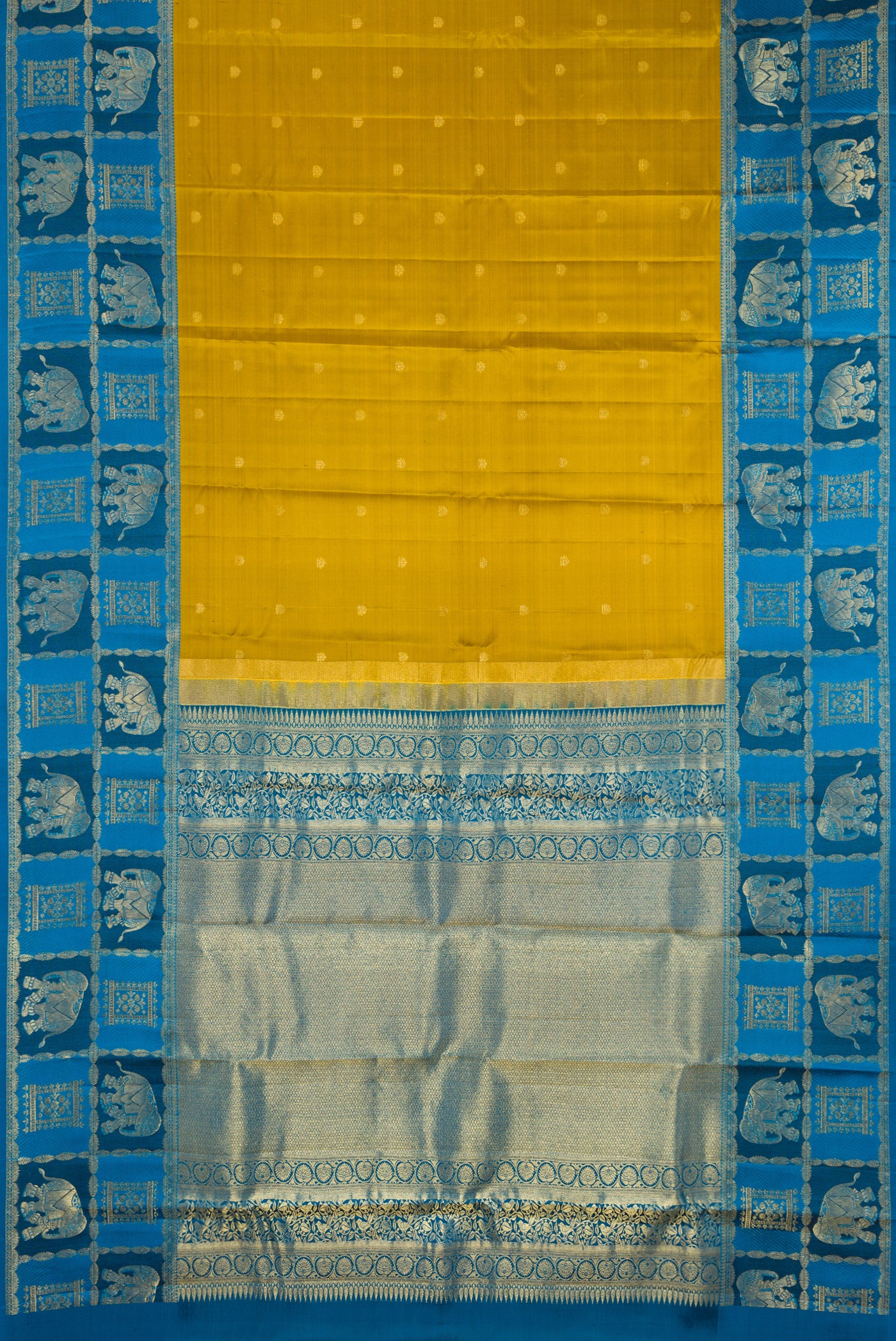 Mehandi Green Dual Tone Kanchipuram Silk Saree with Zari Butta on the body and Fancy Border.  displayed on a mannequin