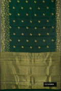 Bottle Green Dual Tone Kanchipuram Silk Saree with Zari Butta on the body and Fancy Border.  displayed on a mannequin