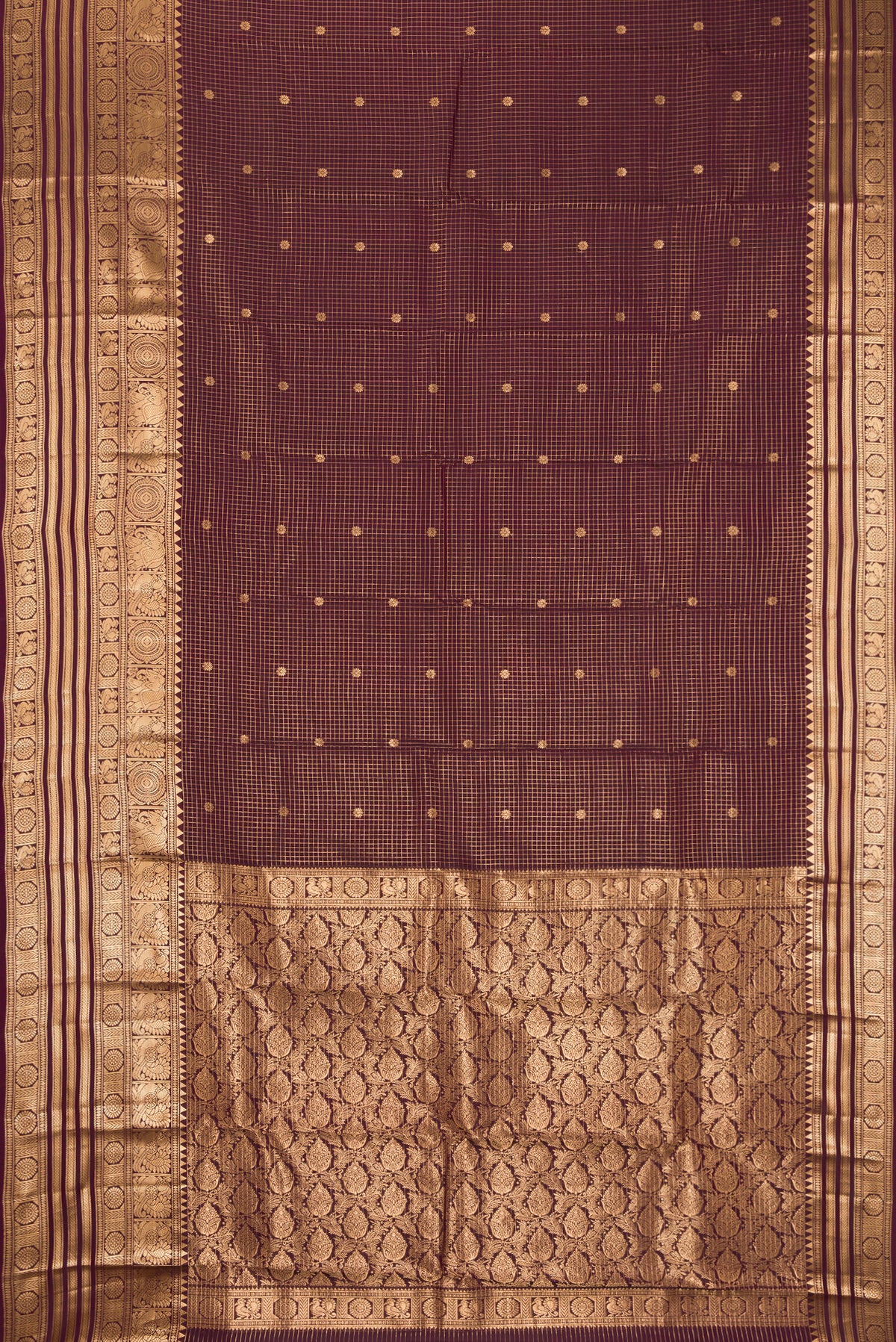 Brown Dual Tone Kanchipuram Silk Saree with Checked design on the body and Fancy Border.  displayed on a mannequin