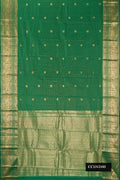 Green Dual Tone Kanchipuram Silk Saree with Checked design on the body and Zari Border.  displayed on a mannequin