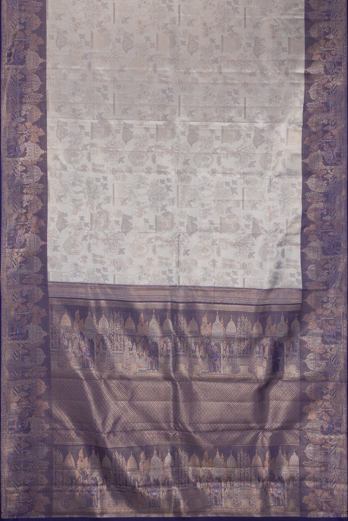 Grey Dual Tone Kanchipuram Tissue Silk Saree with Zari Brocade on the body and Fancy Border.  displayed on a mannequin