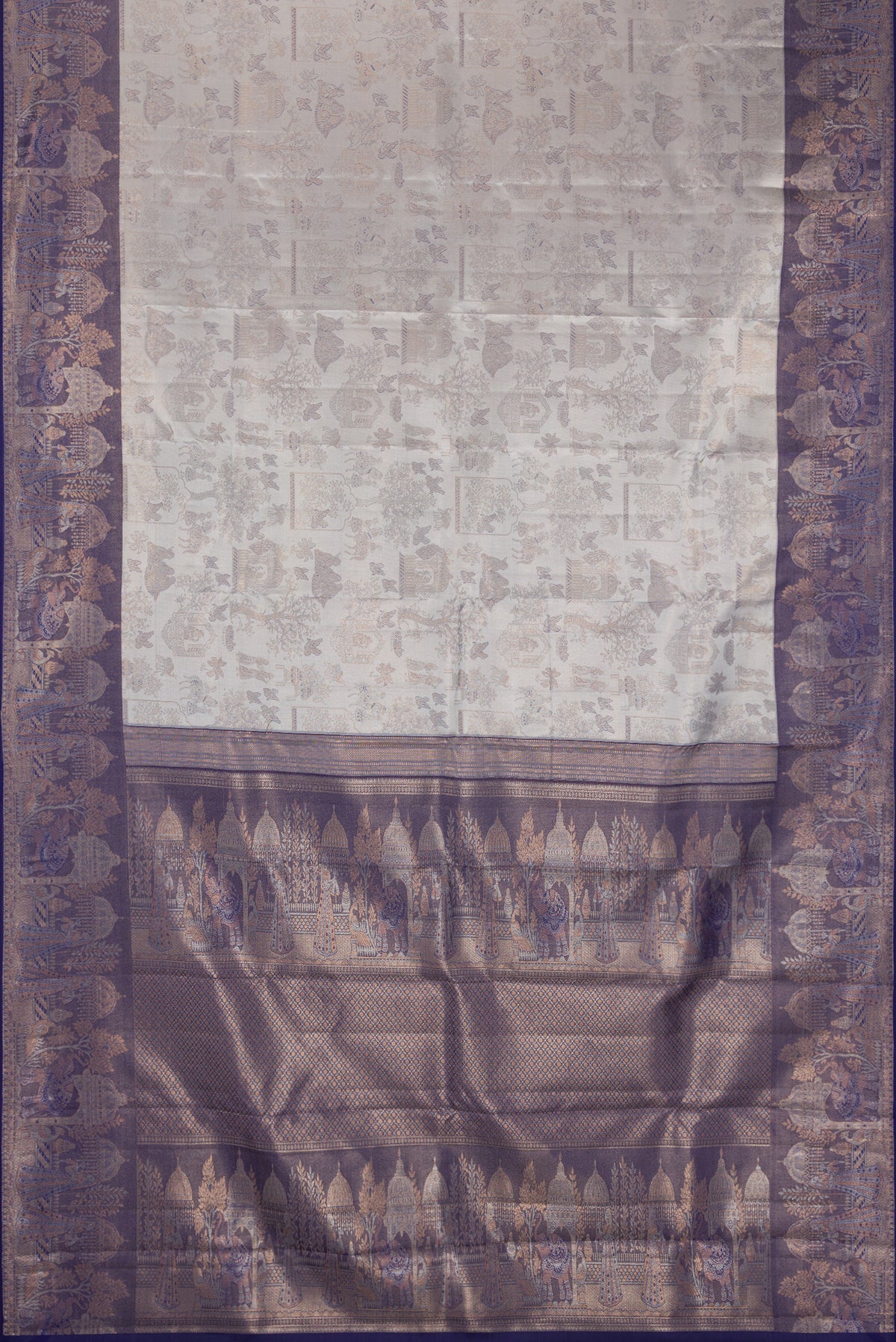 Grey Dual Tone Kanchipuram Tissue Silk Saree with Zari Brocade on the body and Fancy Border.  displayed on a mannequin