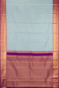 Light Blue Dual Tone Kanchipuram Silk Saree with Zari Butta on the body and Zari Border.  displayed on a mannequin