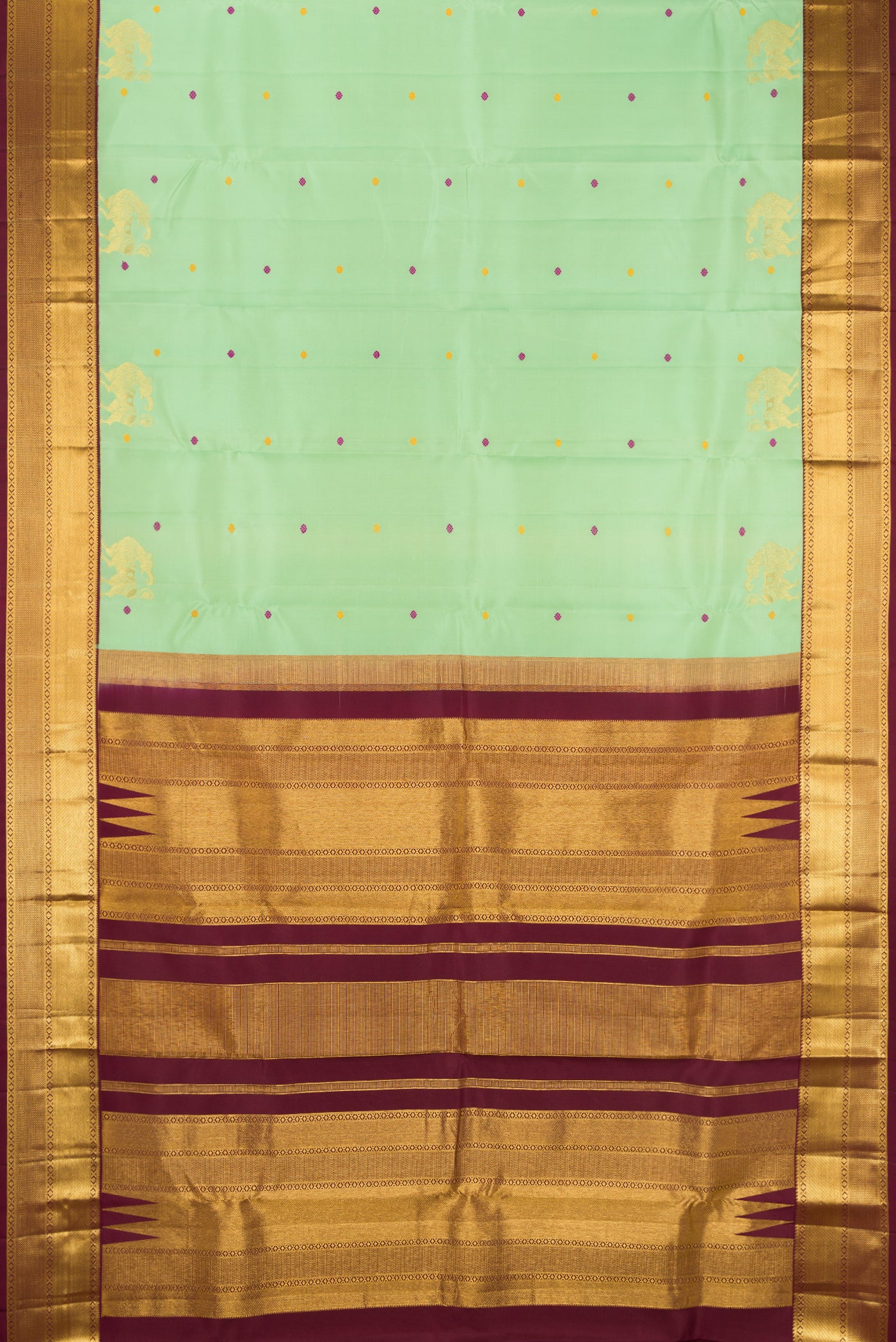 Pista Green Dual Tone Kanchipuram Silk Saree with Zari And Thread Butta on the body and Zari Border.  displayed on a mannequin