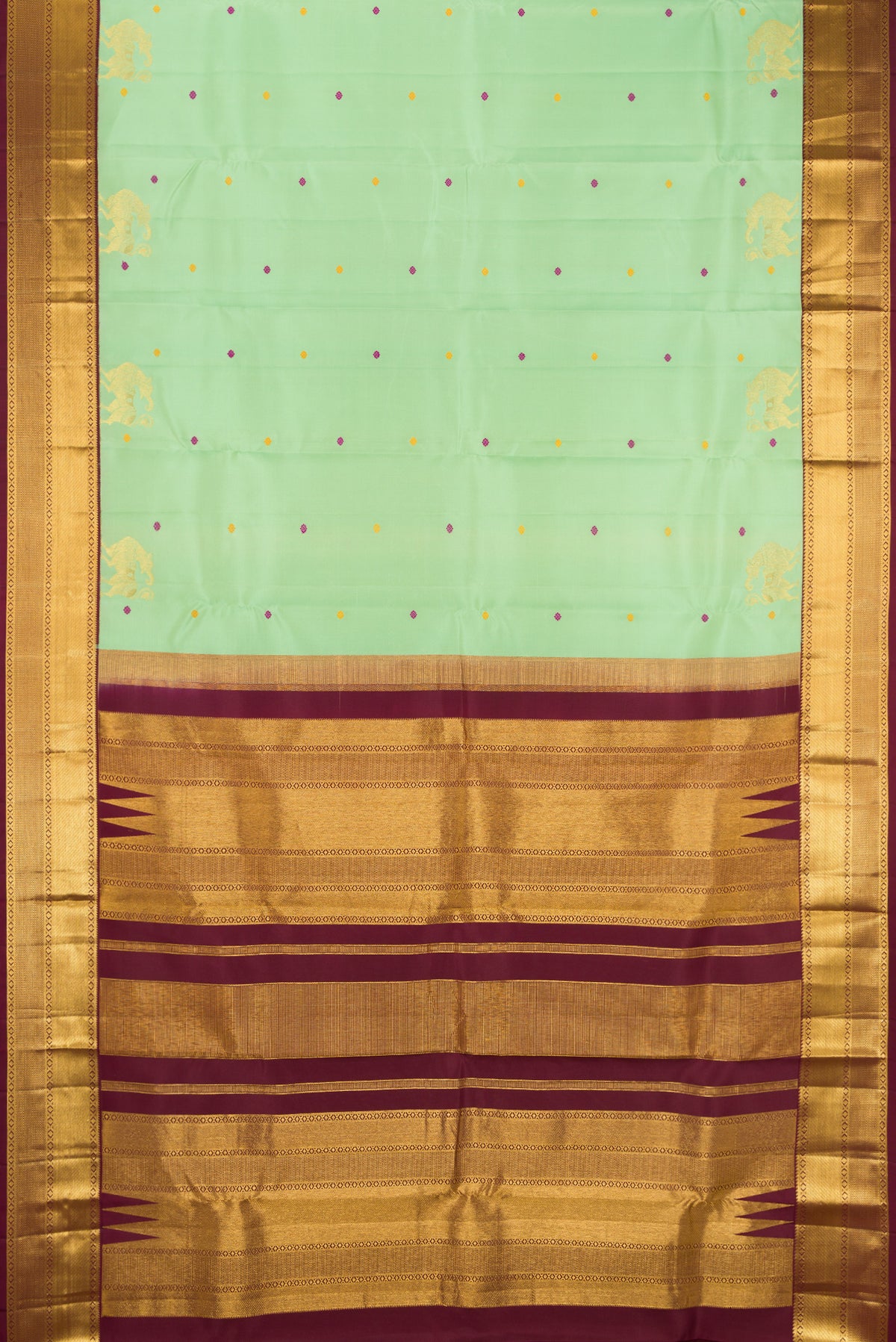 Pista Green Dual Tone Kanchipuram Silk Saree with Zari And Thread Butta on the body and Zari Border.  displayed on a mannequin