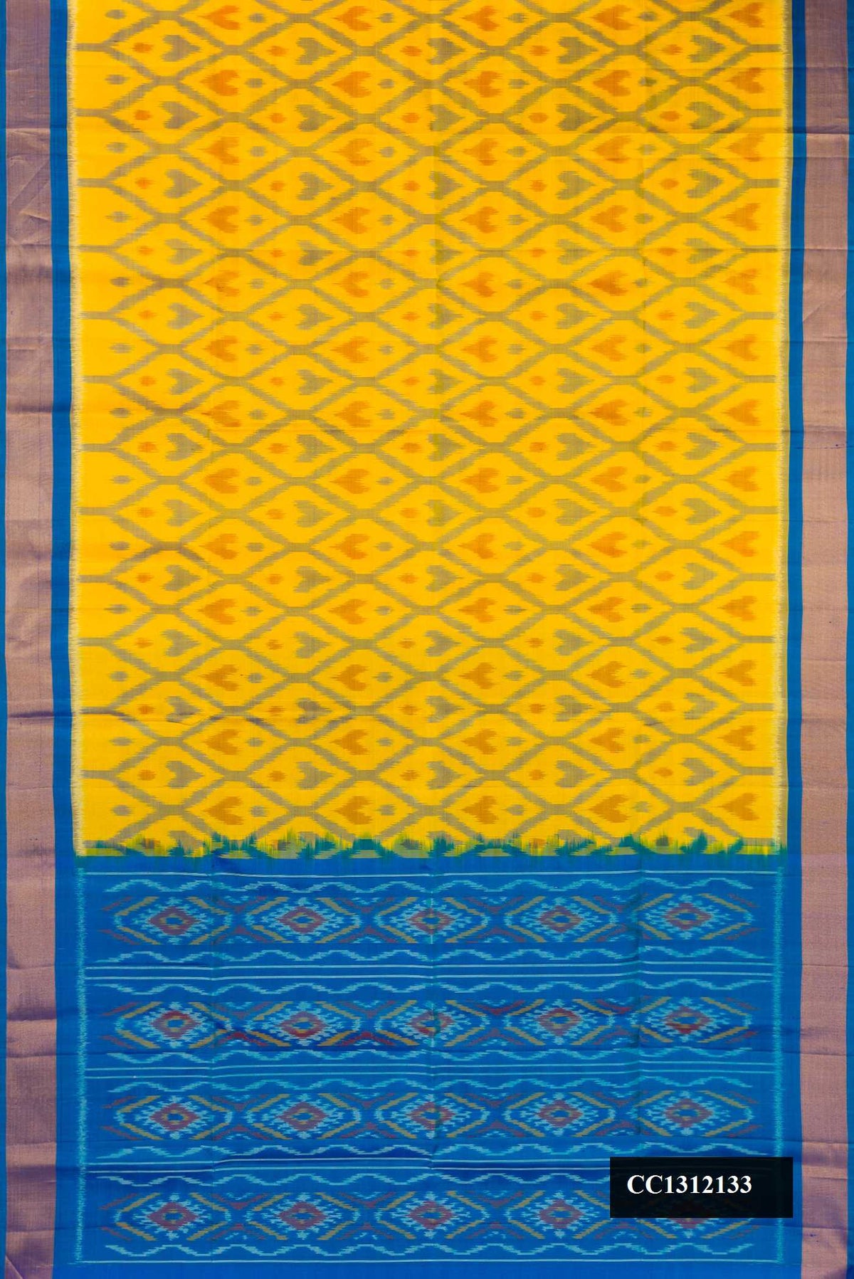 Mustard Dual Tone Soft Silk Saree with Ikat Print on the body and Zari Border.  displayed on a mannequin