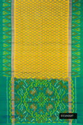 Mustard Dual Tone Soft Silk Saree with Ikat Print on the body and Ikat Border.  displayed on a mannequin