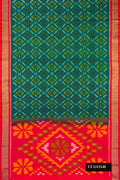 Green Dual Tone Soft Silk Saree with Ikat Print on the body and Zari Border.  displayed on a mannequin