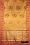 Gold Dual Tone Kanchipuram Tissue Silk Saree with Zari Brocade on the body and Fancy Border.  displayed on a mannequin