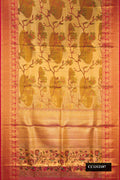 Gold Dual Tone Kanchipuram Tissue Silk Saree with Zari Brocade on the body and Fancy Border.  displayed on a mannequin