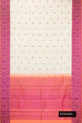 Off White Dual Tone Kanchipuram Silk Saree with Thread Butta on the body and Thread Border.  displayed on a mannequin