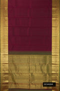 Burgundy Dual Tone Kanchipuram Silk Saree with Checked design on the body and Zari Border.  displayed on a mannequin