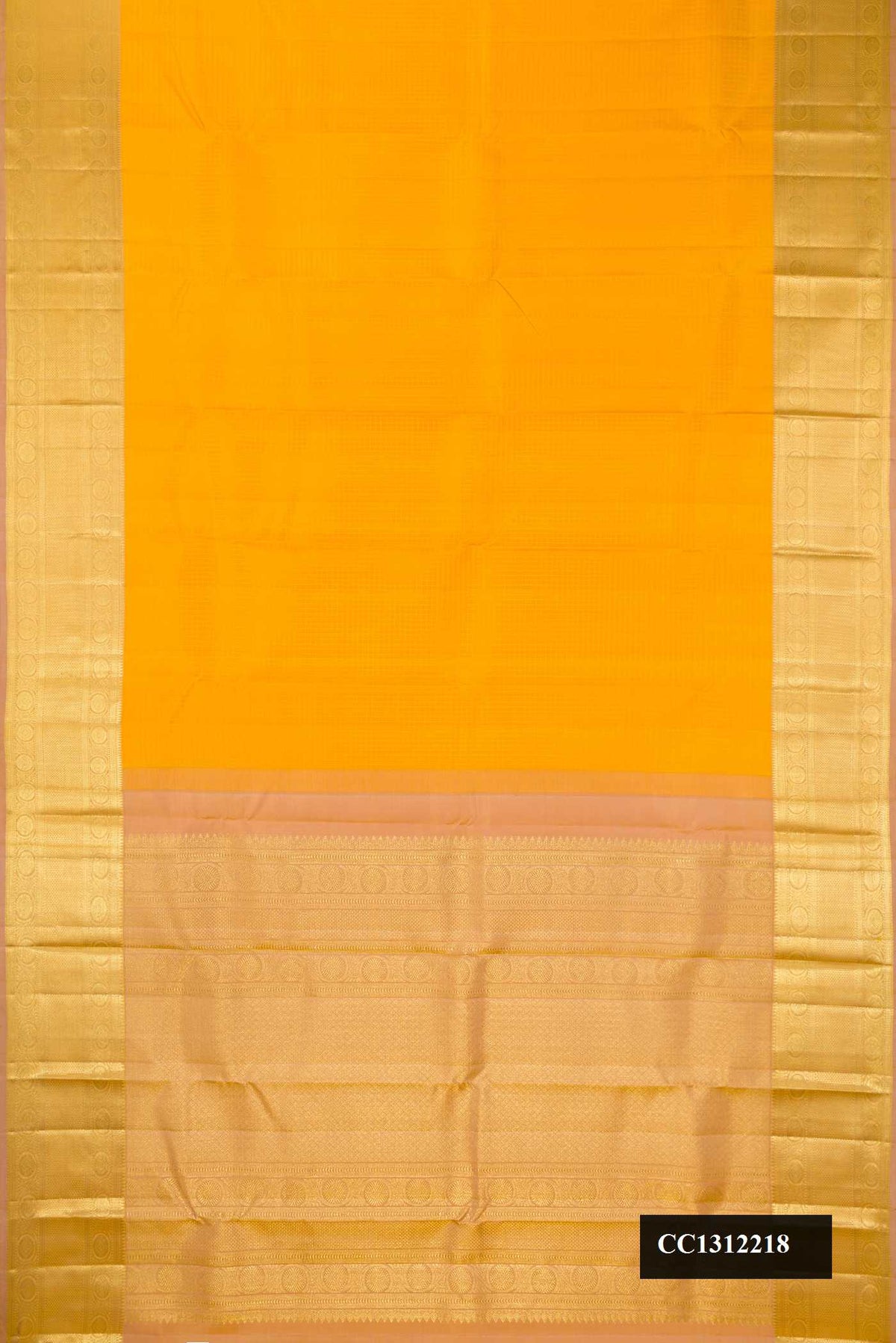 Mustard Dual Tone Kanchipuram Silk Saree with Checked design on the body and Zari Border.  displayed on a mannequin