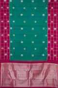 Green Dual Tone Kanchipuram Silk Saree with Zari Butta on the body and Fancy Border.  displayed on a mannequin