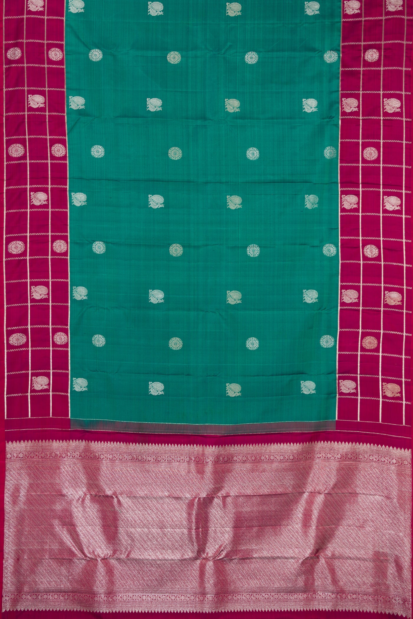 Green Dual Tone Kanchipuram Silk Saree with Zari Butta on the body and Fancy Border.  displayed on a mannequin