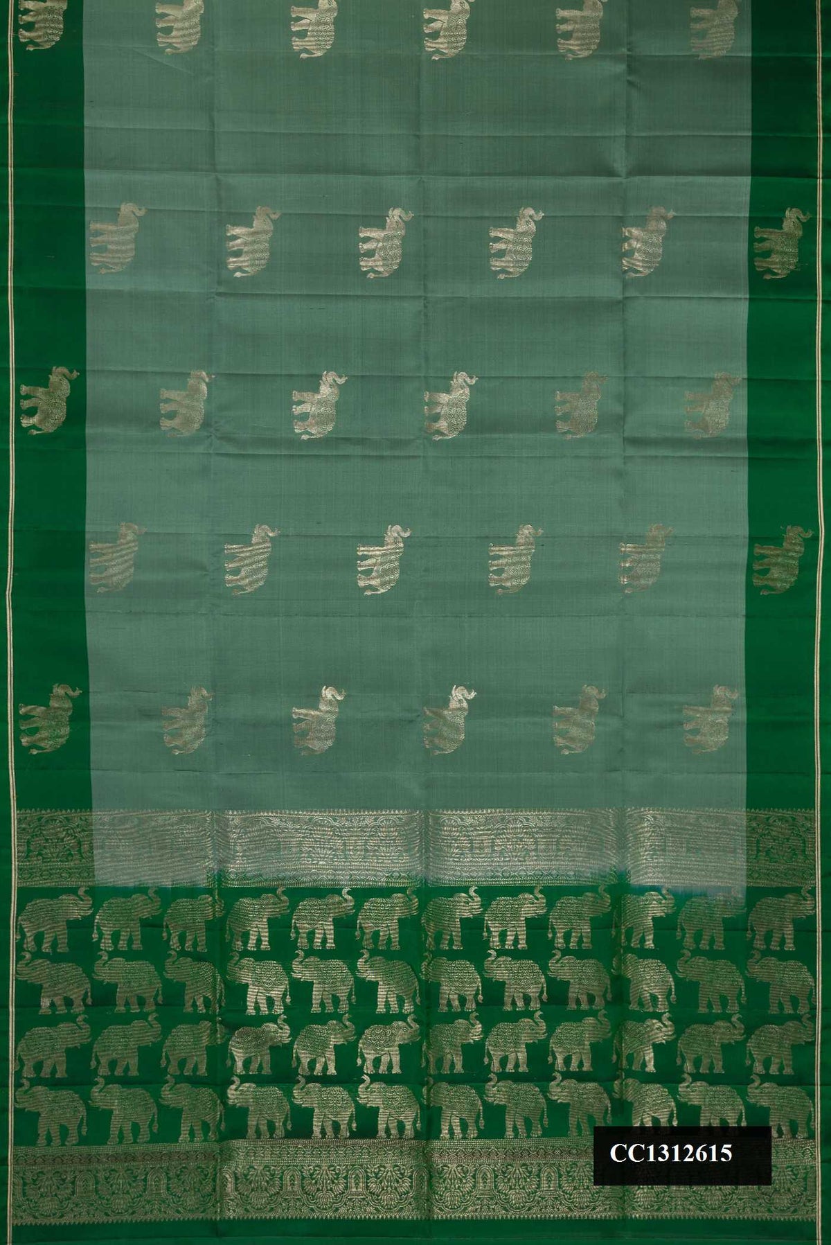 Light Green Dual Tone Soft Silk Saree with Zari Butta on the body and Fancy Border.  displayed on a mannequin