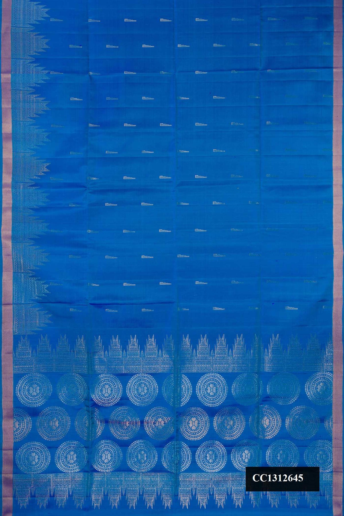 Peacock Blue Dual Tone Soft Silk Saree with Zari Butta on the body and Fancy Border.  displayed on a mannequin