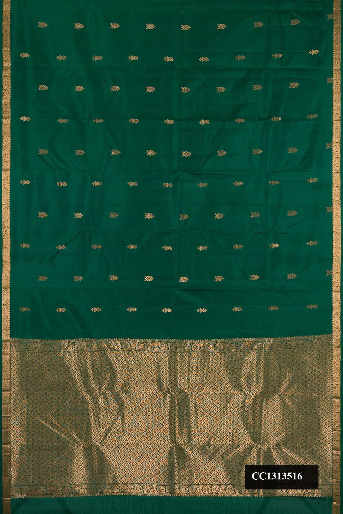 Bottle Green Dual Tone Kanchipuram Silk Saree with Stripes on the body and Zari Border.  displayed on a mannequin