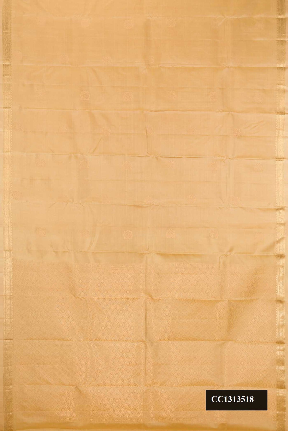 Beige Dual Tone Kanchipuram Silk Saree with Zari Butta on the body and Zari Border.  displayed on a mannequin