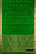 Green Dual Tone Kanchipuram Silk Saree with Zari Butta on the body and Zari Border.  displayed on a mannequin