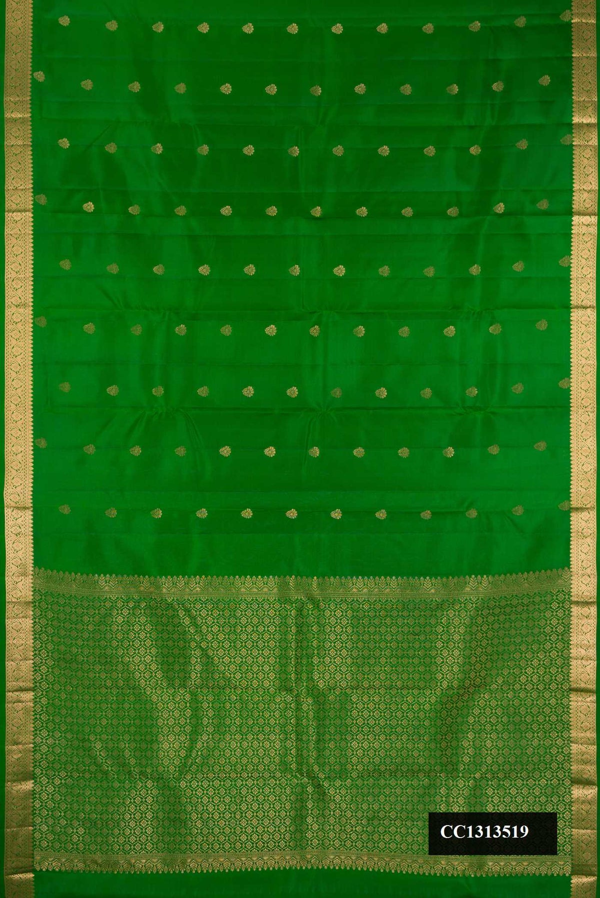 Green Dual Tone Kanchipuram Silk Saree with Zari Butta on the body and Zari Border.  displayed on a mannequin