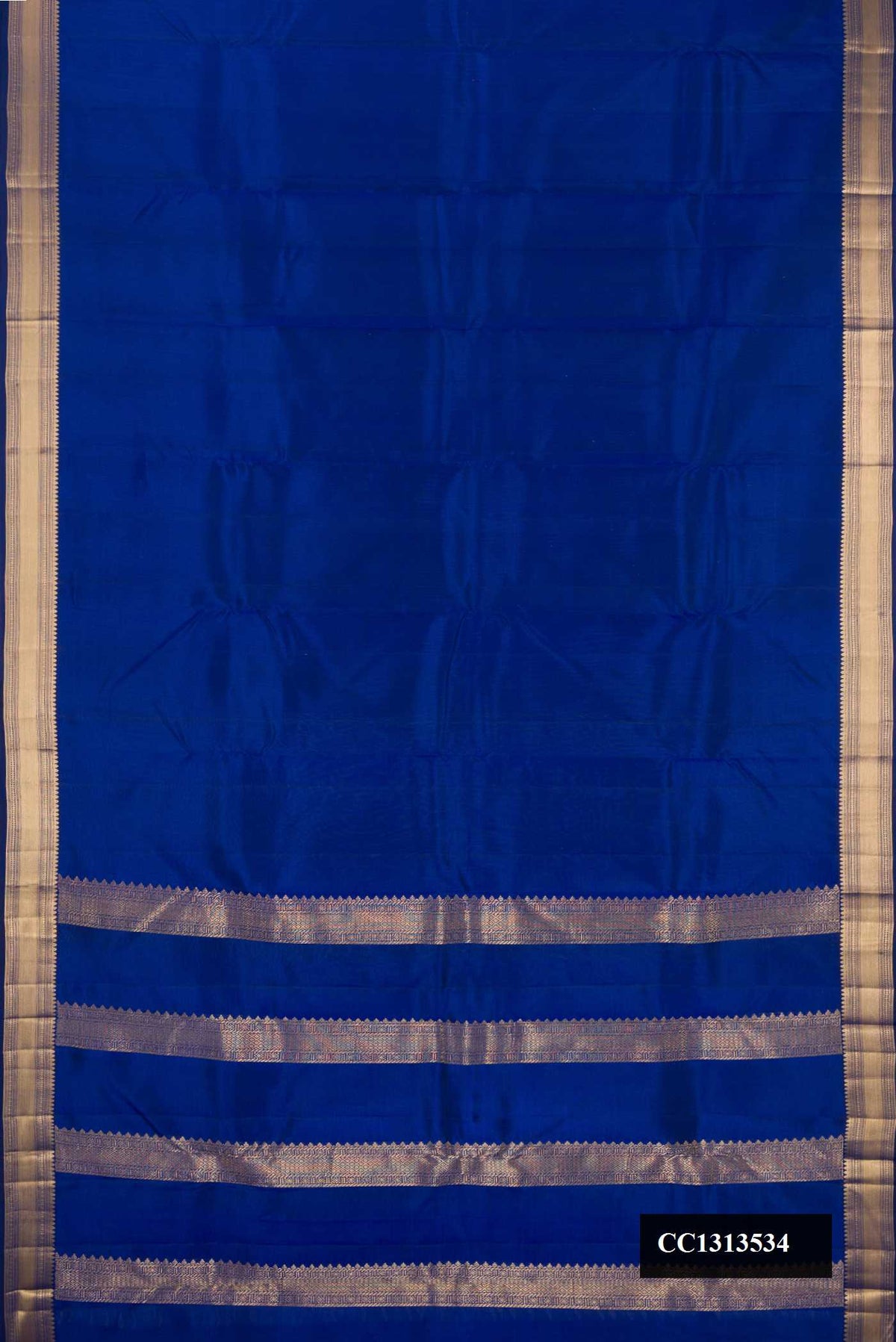 Royal Blue Dual Tone Kanchipuram Silk Saree with Plain Body and Zari Border.  displayed on a mannequin