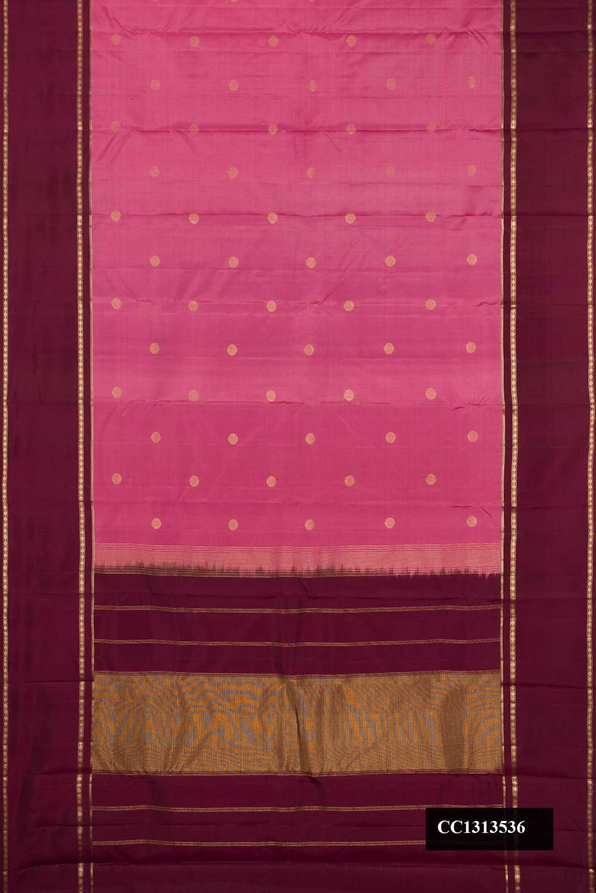 Rose Gold Dual Tone Kanchipuram Silk Saree with Zari Butta on the body and Zari Border.  displayed on a mannequin