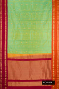 Pista Green Dual Tone Kanchipuram Silk Saree with Zari Butta on the body and Ganga Jamuna Border.  displayed on a mannequin