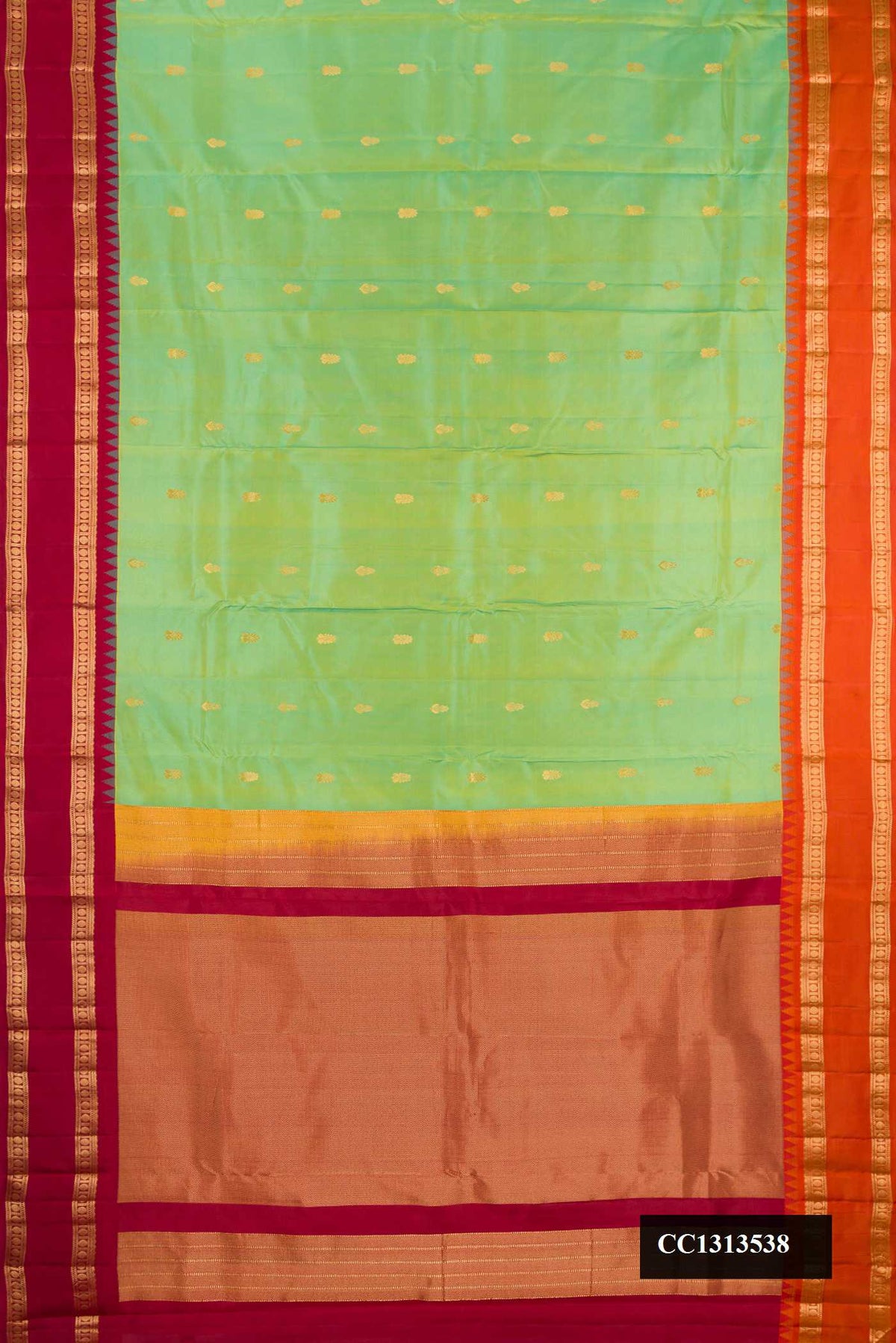 Pista Green Dual Tone Kanchipuram Silk Saree with Zari Butta on the body and Ganga Jamuna Border.  displayed on a mannequin