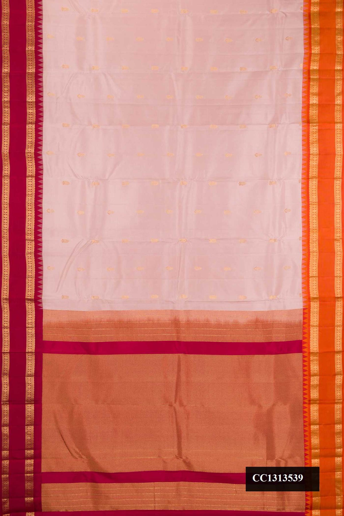 Rose Gold Dual Tone Kanchipuram Silk Saree with Zari Butta on the body and Ganga Jamuna Border.  displayed on a mannequin