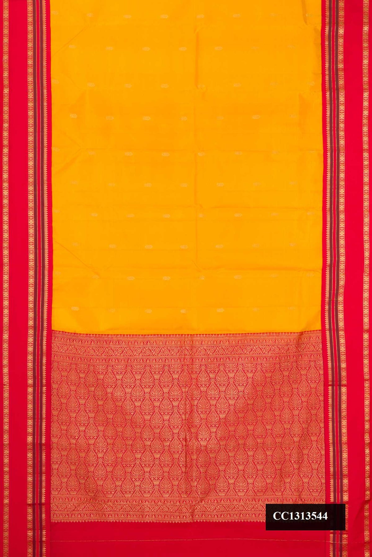 Mustard Dual Tone Kanchipuram Silk Saree with Zari Butta on the body and Fancy Border.  displayed on a mannequin