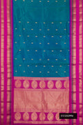 Peacock Blue Dual Tone Kanchipuram Silk Saree with Zari Butta on the body and Fancy Border.  displayed on a mannequin