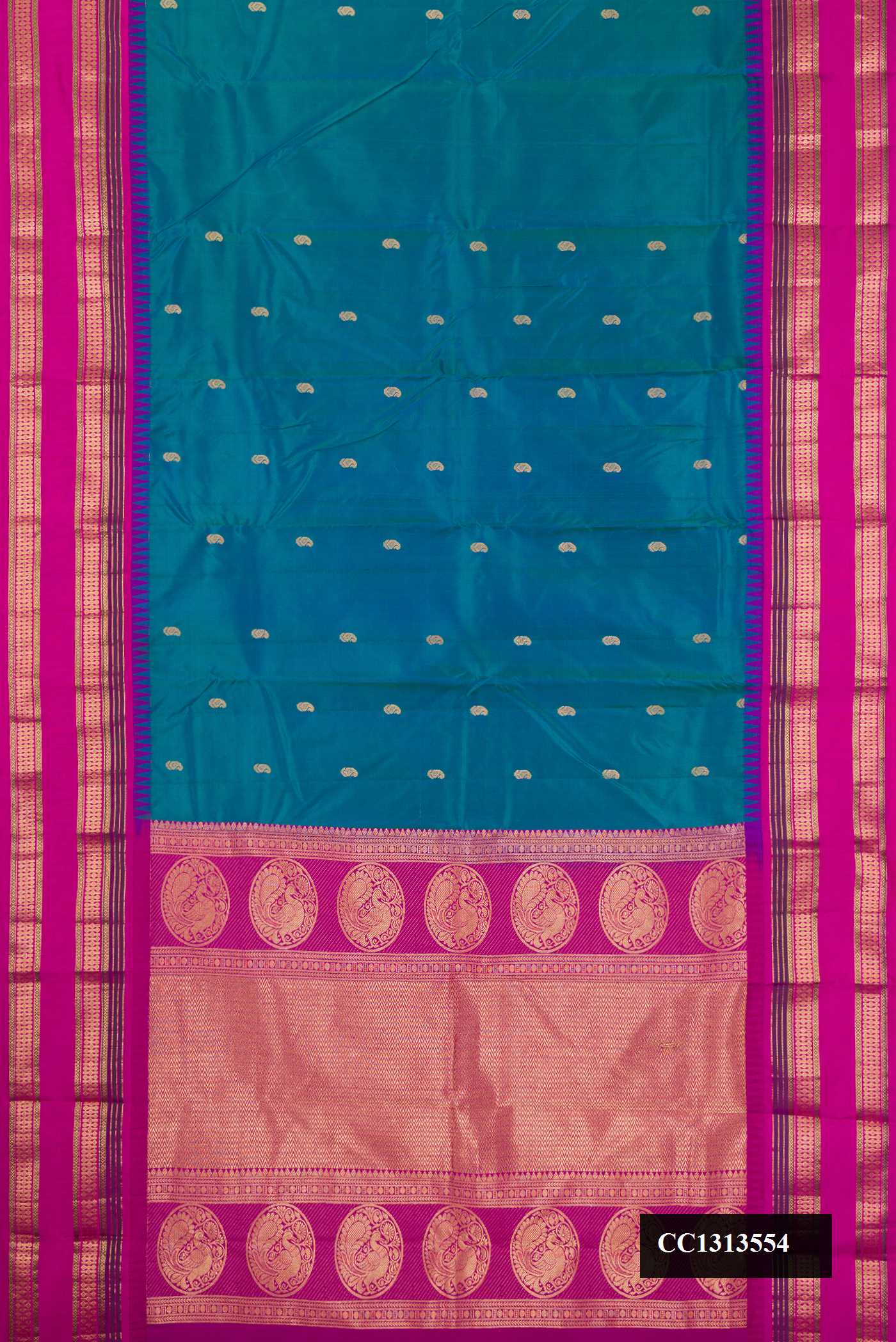 Peacock Blue Dual Tone Kanchipuram Silk Saree with Zari Butta on the body and Fancy Border.  displayed on a mannequin