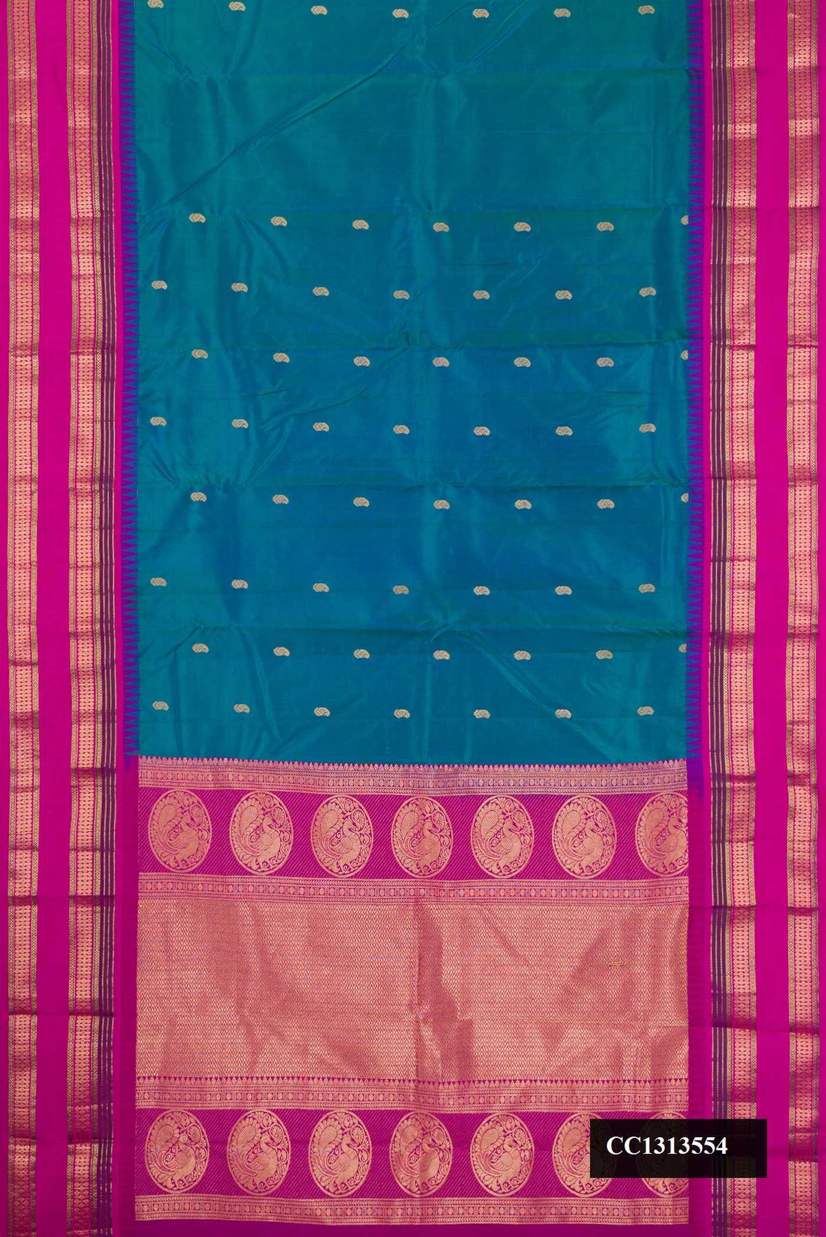 Peacock Blue Dual Tone Kanchipuram Silk Saree with Zari Butta on the body and Fancy Border.  displayed on a mannequin